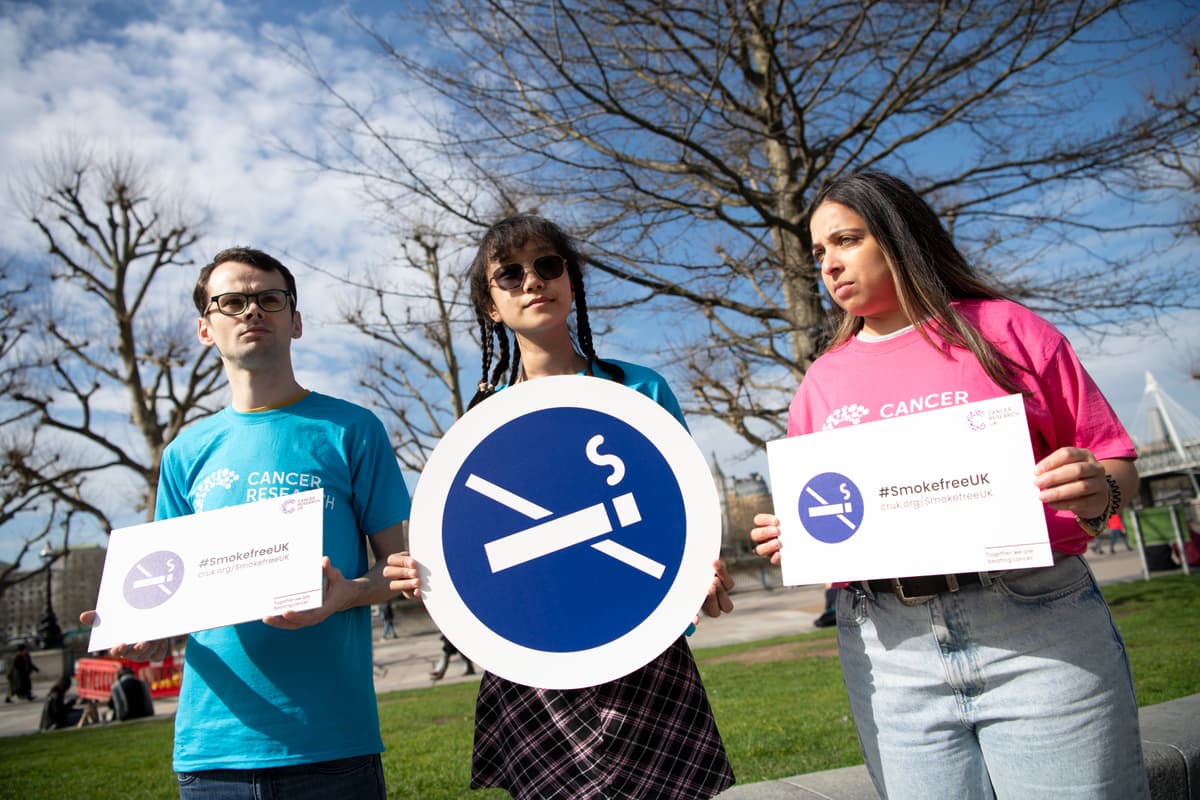 A photo of a group of Campaign Ambassadors holding Smokefree signs.