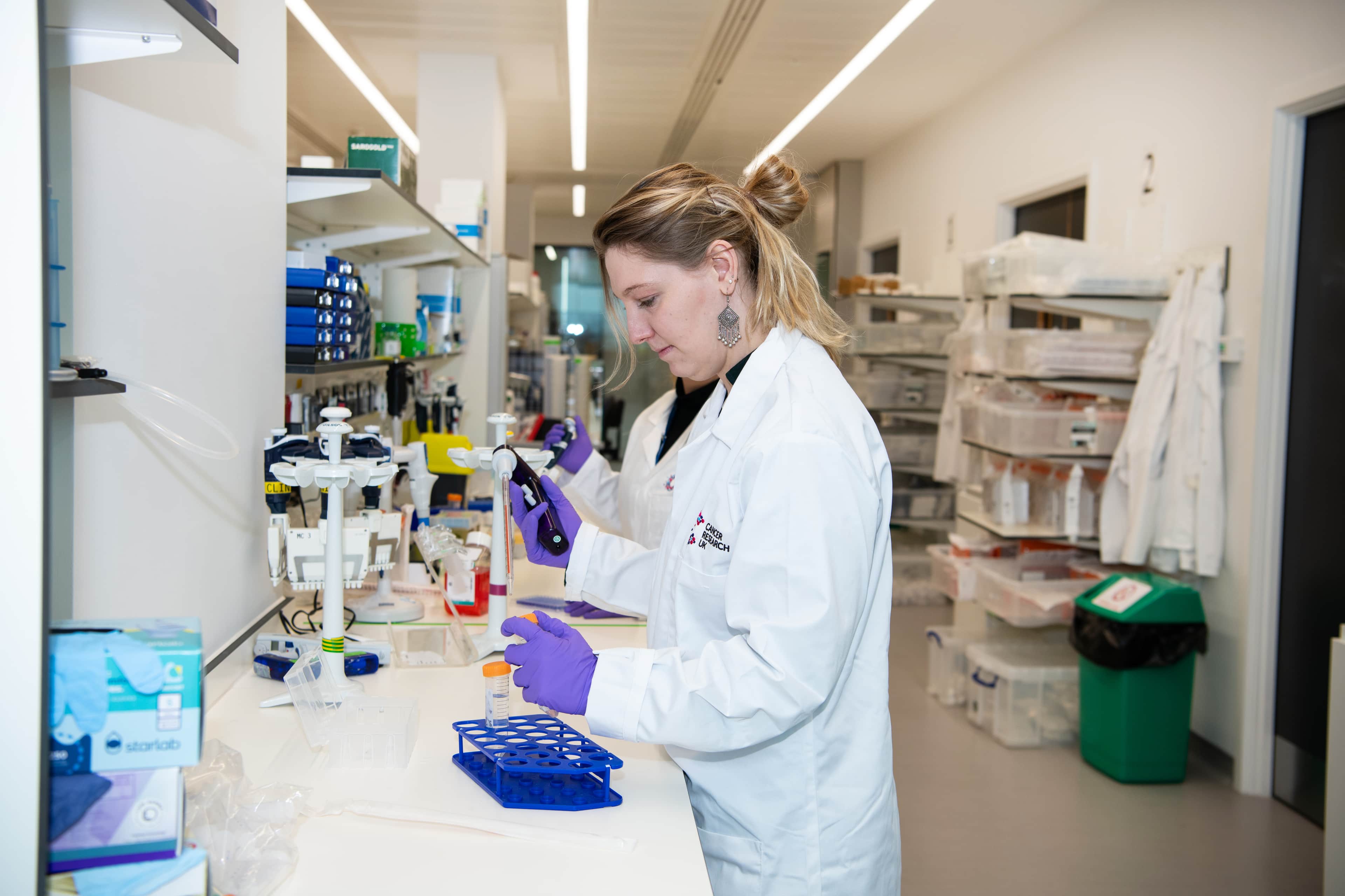 A female scientist conducting research in a lab.