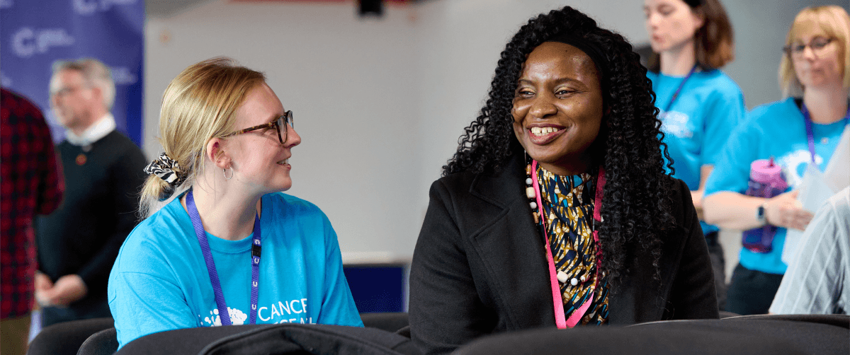 A photo of panel members in a meeting.