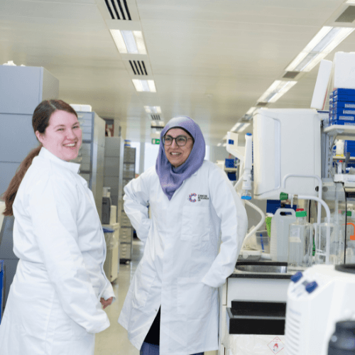 Smiling shot of a researchers in the lab.