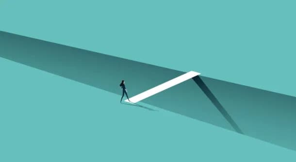 Stock image of person crossing a gap on a teal background.