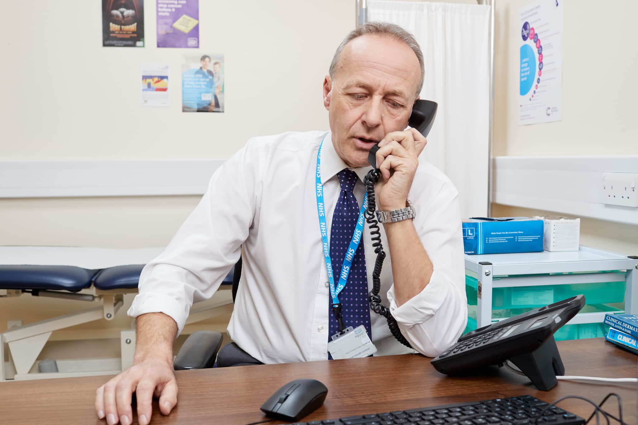 This photo shows a GP on the phone.