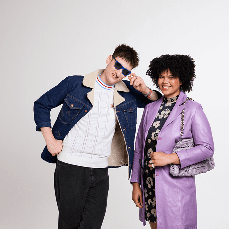 A photo of two people smiling.