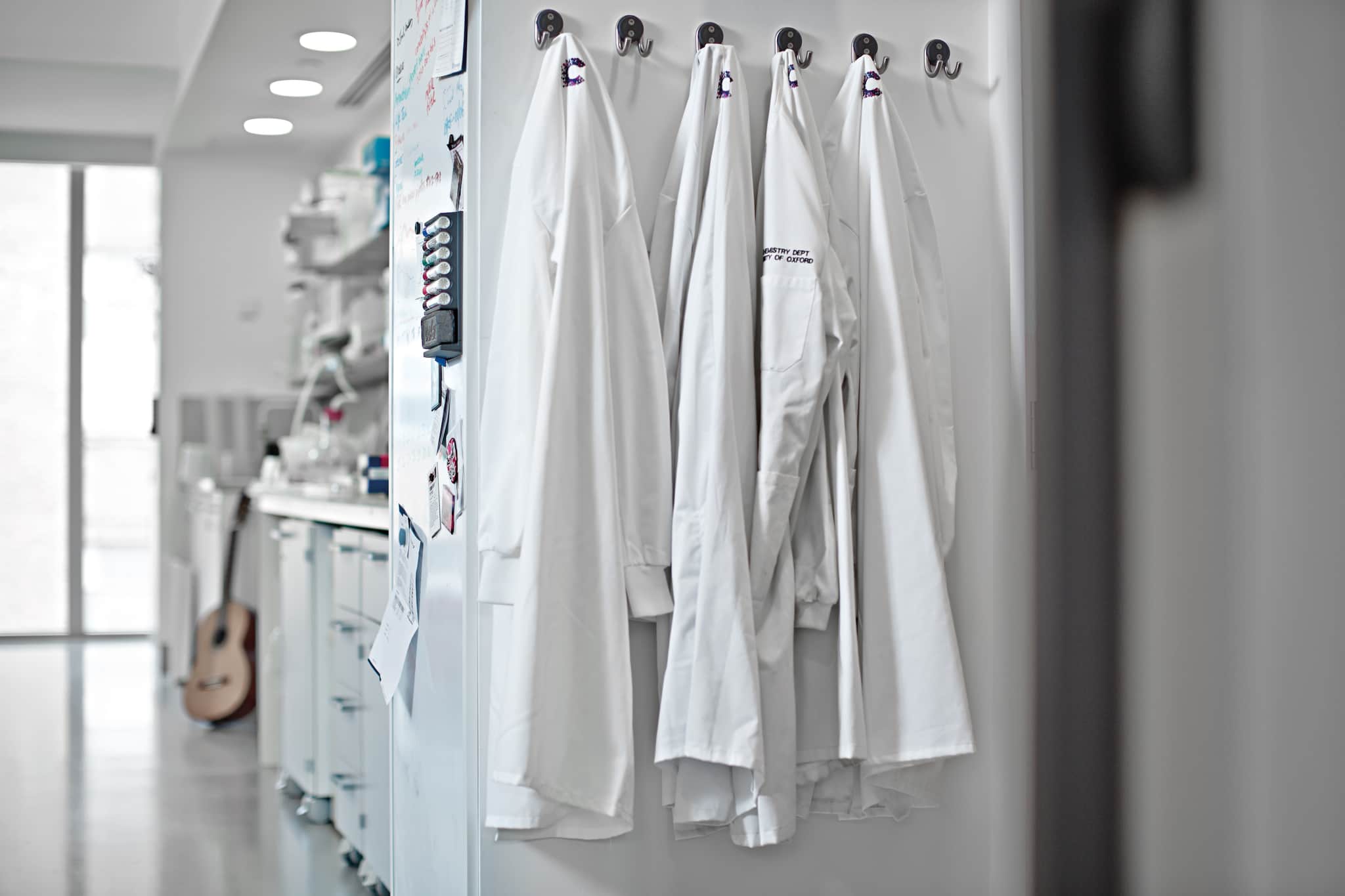 Laboratory coats hanging in the laboratory at Oxford Institute.