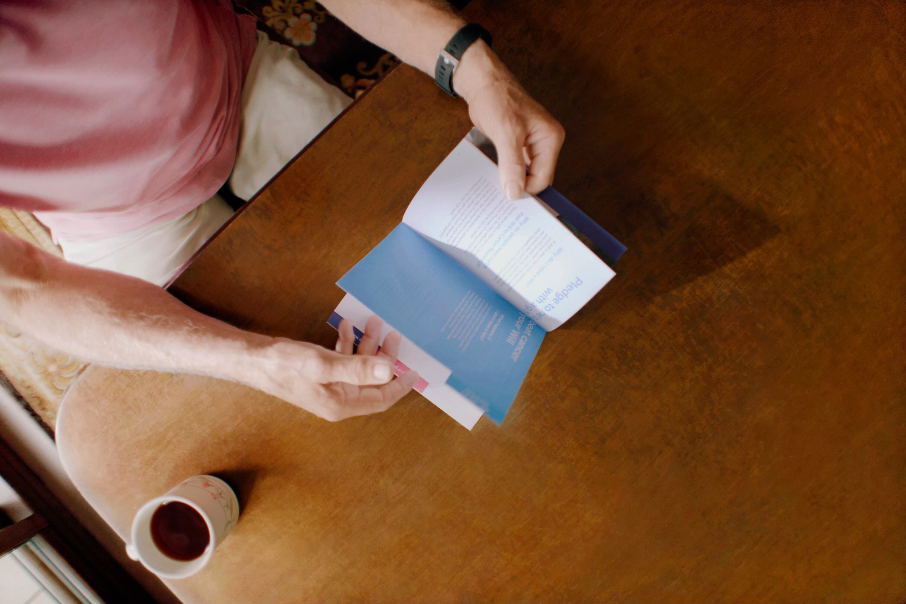 Person reading a Gifts in Wills Guide.