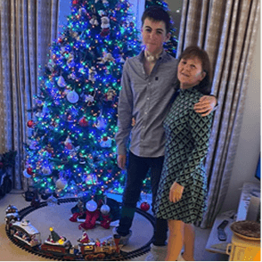 Two people posing for the photo, holding each other. A CRUK for Children and Young People logo appears on the front.