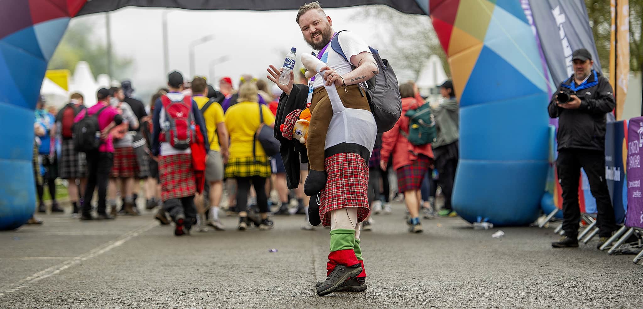 Man at Kiltwalk finish line.
