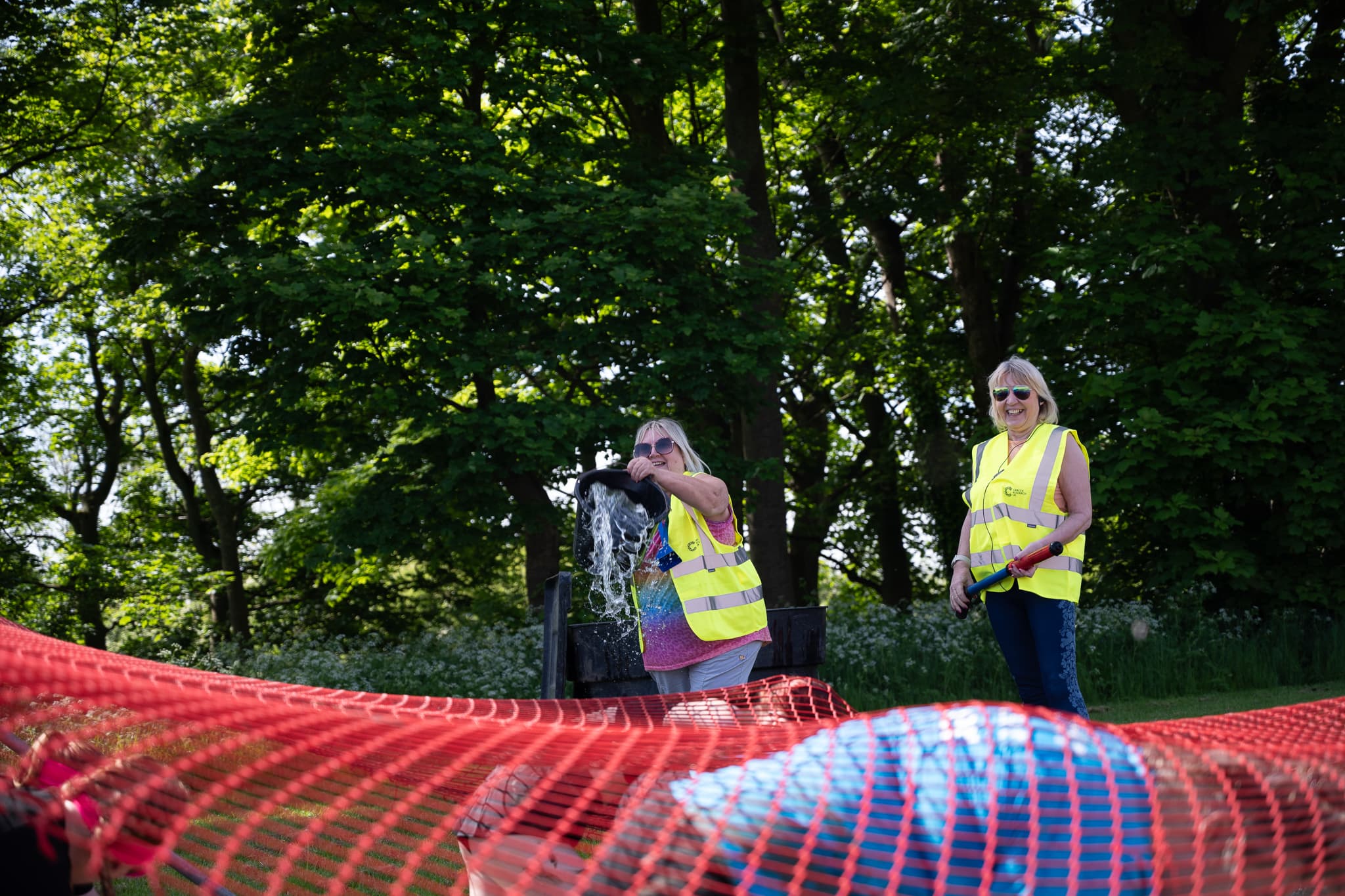 Race officials wearing high vis vests. Race For Life - Leeds (Closed event) 2024.