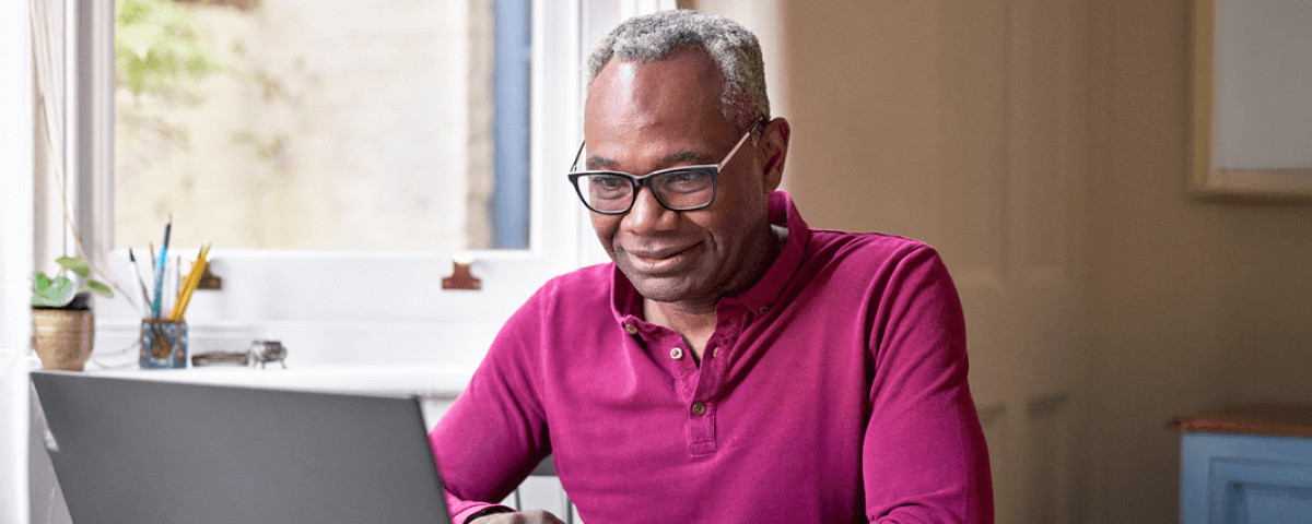 Man looking at a laptop.